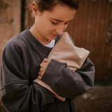 Pink hot water bottle with cherry seeds